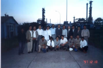 Take a group photo in the site with employees
